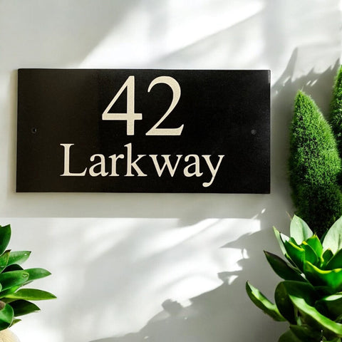 Introducing our stunning 30cm x 15cm Polished Natural Slate House Sign, designed to make a lasting impression! Crafted with durability in mind, it features beautifully carved lettering that enhances its elegance and visibility. Transform your home's entrance with this exquisite sign! www.HouseSign.co.uk