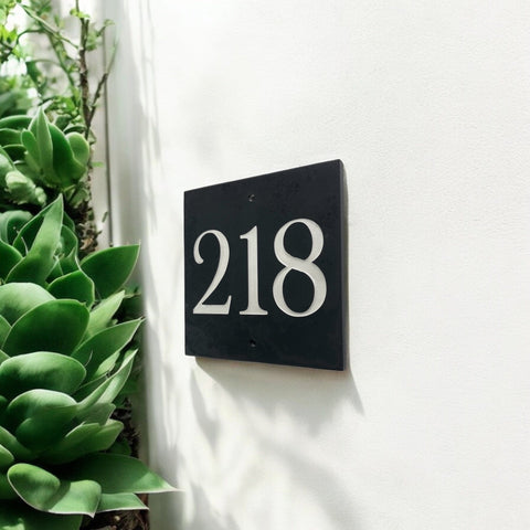 Introducing our stunning 15cm x 15cm Polished Natural Slate House Sign, designed to make a lasting impression! Crafted with durability in mind, it features beautifully carved lettering that enhances its elegance and visibility. Transform your home's entrance with this exquisite sign! www.HouseSign.co.uk