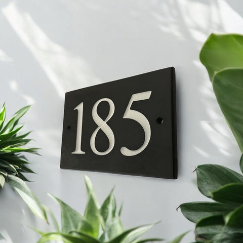 Introducing our stunning 20cm x 10cm Polished Natural Slate House Sign, designed to make a lasting impression! Crafted with durability in mind, it features beautifully carved lettering that enhances its elegance and visibility. Transform your home's entrance with this exquisite sign! www.HouseSign.co.uk