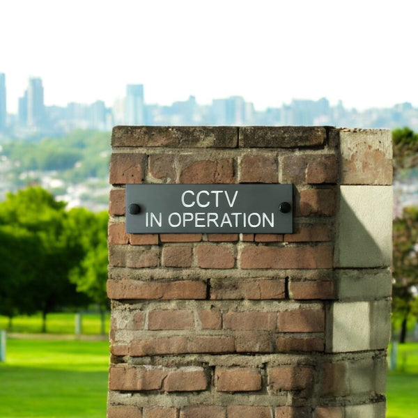 A CCTV Gate Or Wall Sign made in Natural Slate with polished edges and hard-wearing carved lettering size 20cm x 6cm www.HouseSign.co.uk