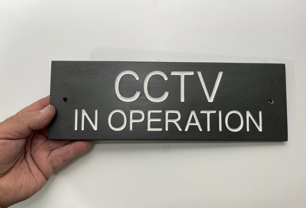 A CCTV Gate Or Wall Sign made in Natural Slate with polished edges and hard-wearing carved lettering size 20cm x 6cm www.HouseSign.co.uk