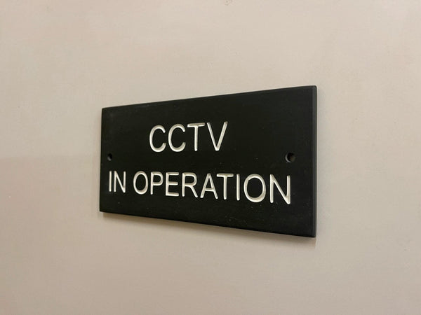 A CCTV Gate Or Wall Sign made in Natural Slate with polished edges and hard-wearing carved lettering www.HouseSign.co.uk