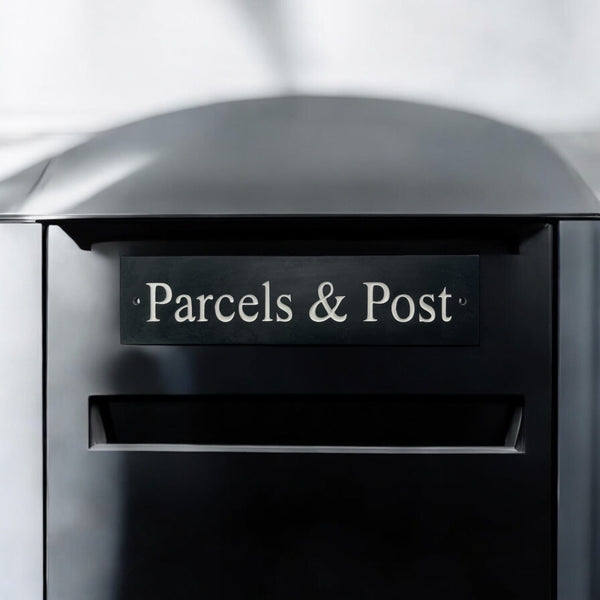 A natural slate carved sign saying Parcels & Post on a mailbox www.HouseSign.uk 