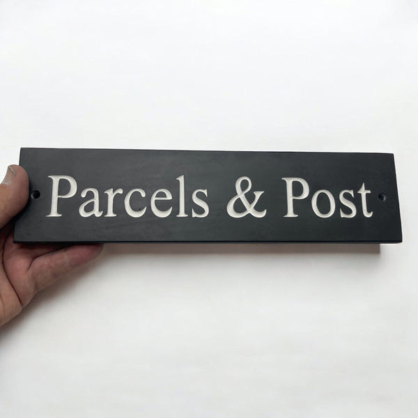 A natural slate carved sign saying Parcels & Post on a mailbox www.HouseSign.uk 