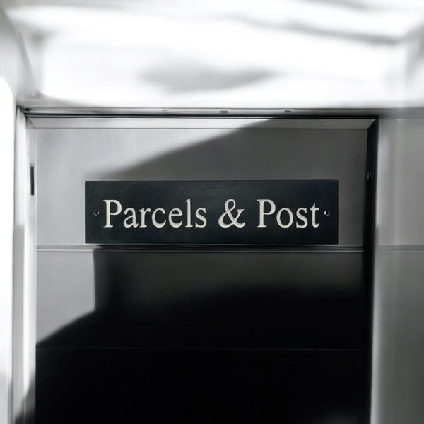 A natural slate carved sign saying Parcels & Post on a mailbox www.HouseSign.uk 