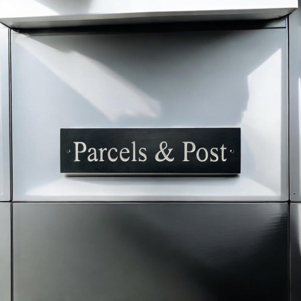 A natural slate carved sign saying Parcels & Post on a mailbox www.HouseSign.uk 