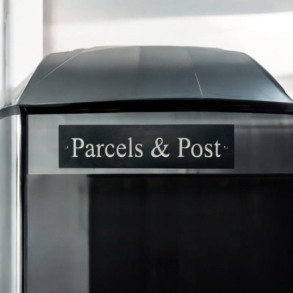 A natural slate carved sign saying Parcels & Post on a mailbox www.HouseSign.uk 